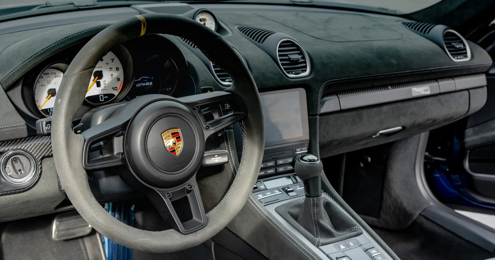 Porsche Cayman GT4 RS steering wheel and instrument cluster.